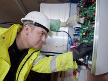 Installer setting up an inverter inside the home